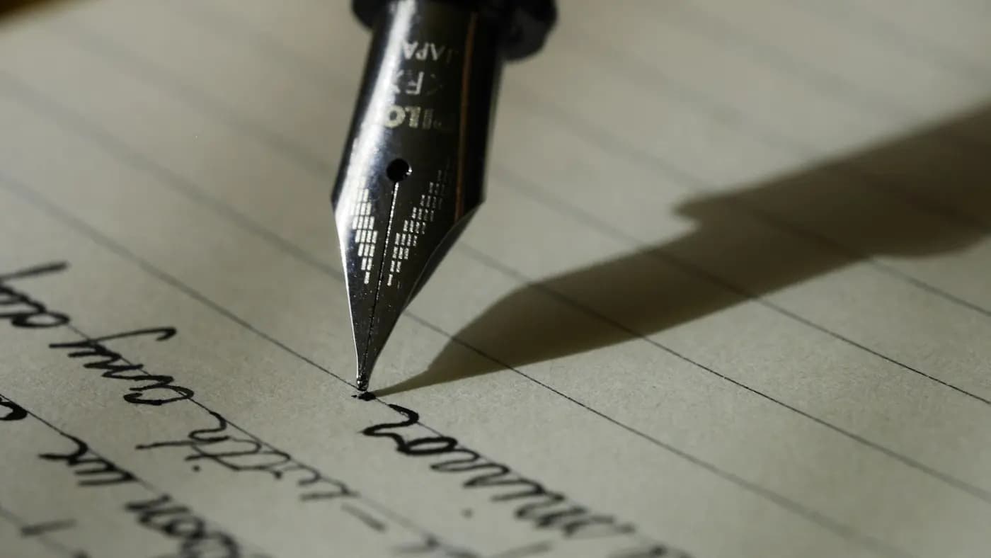 Fountain pen writing on lined paper