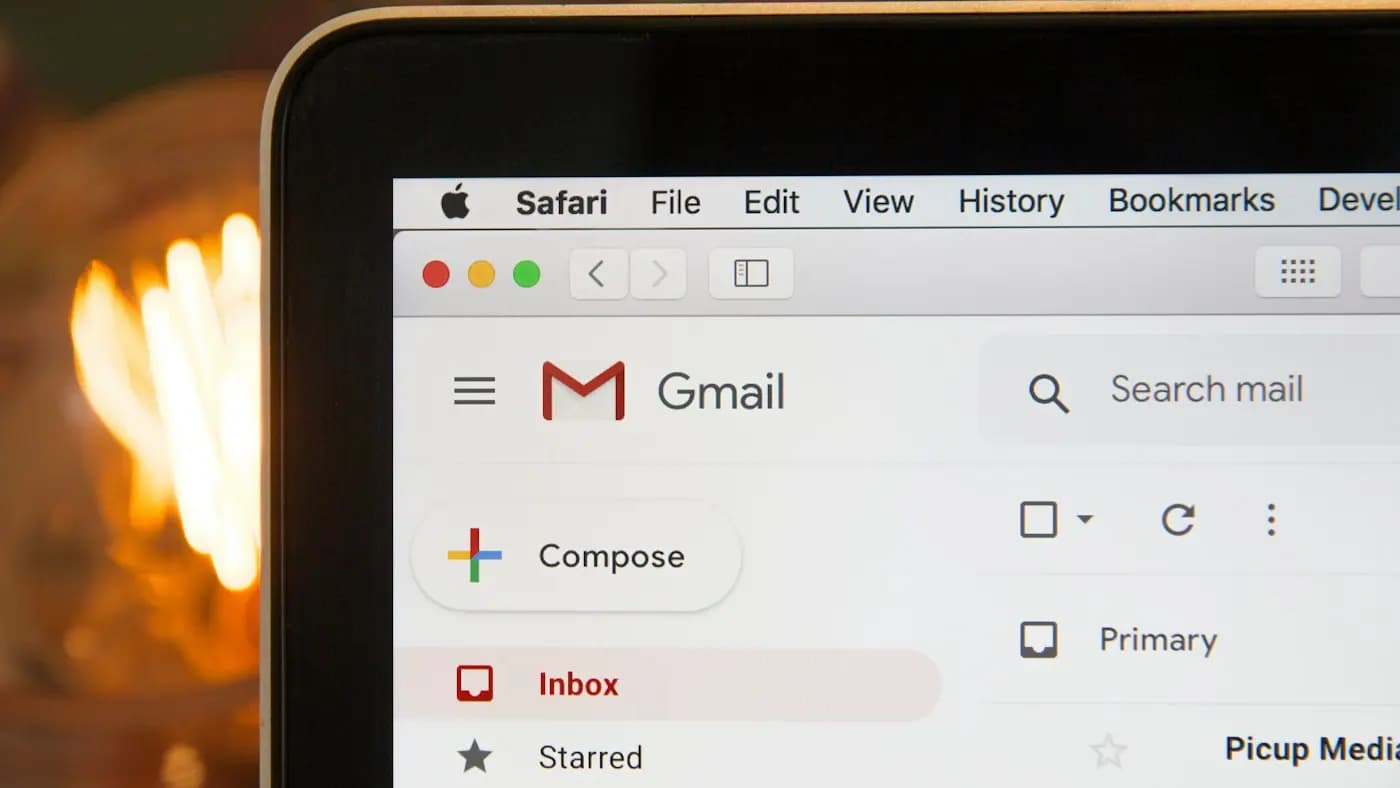 Email inbox with a compose button visible