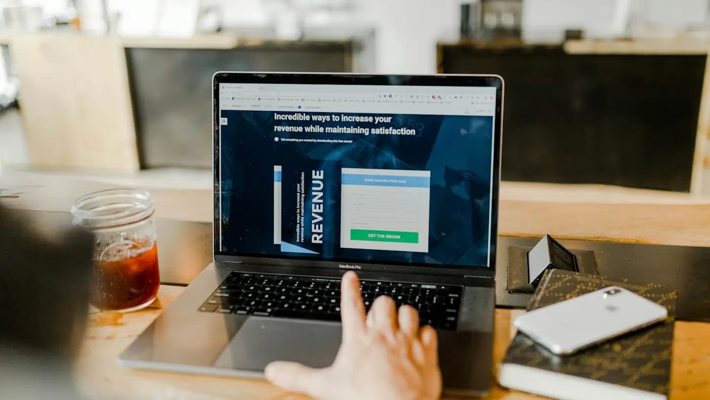 Laptop showing a landing page about revenue