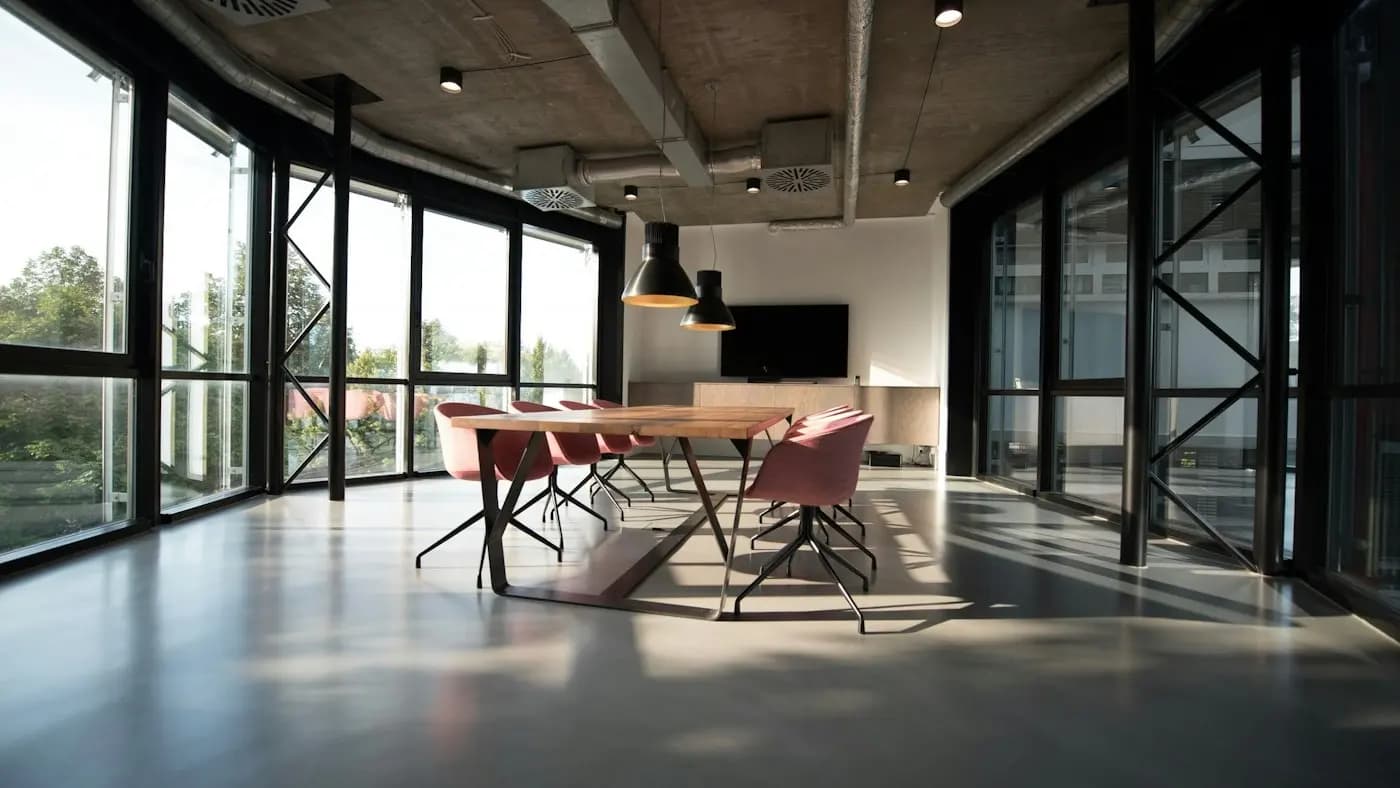 Modern open office with a long table