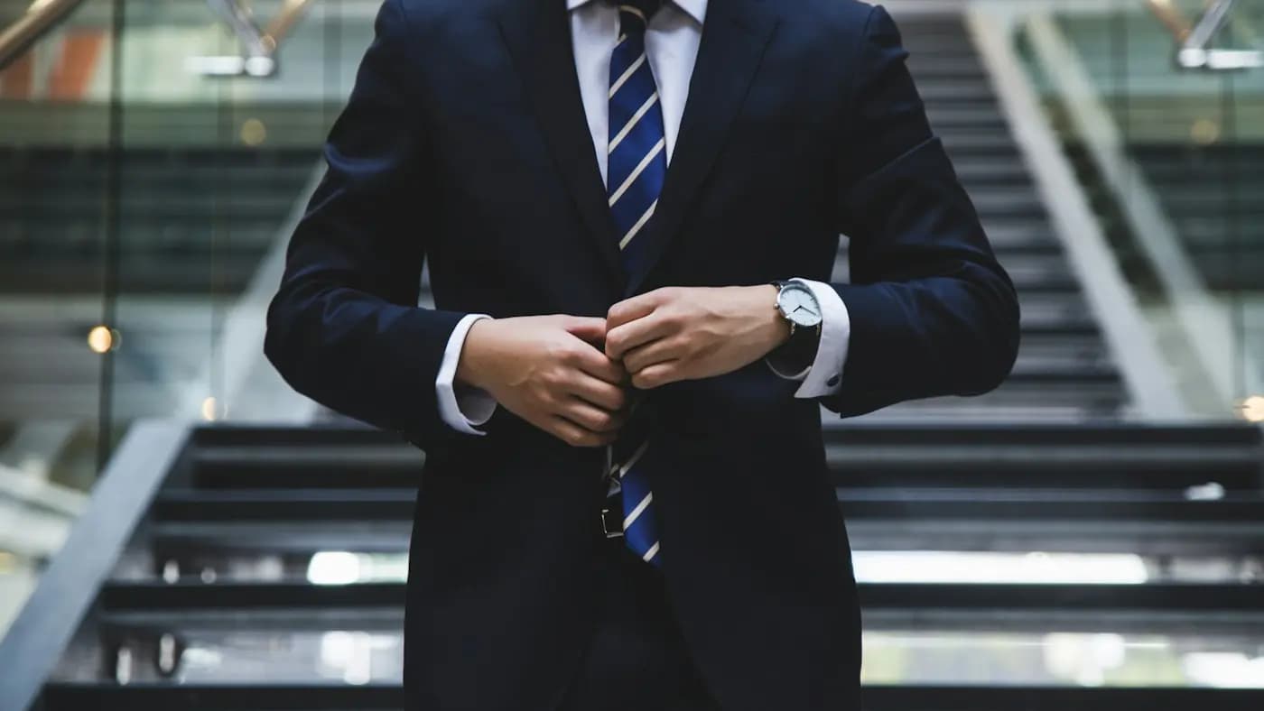 Businessman adjusting his suit