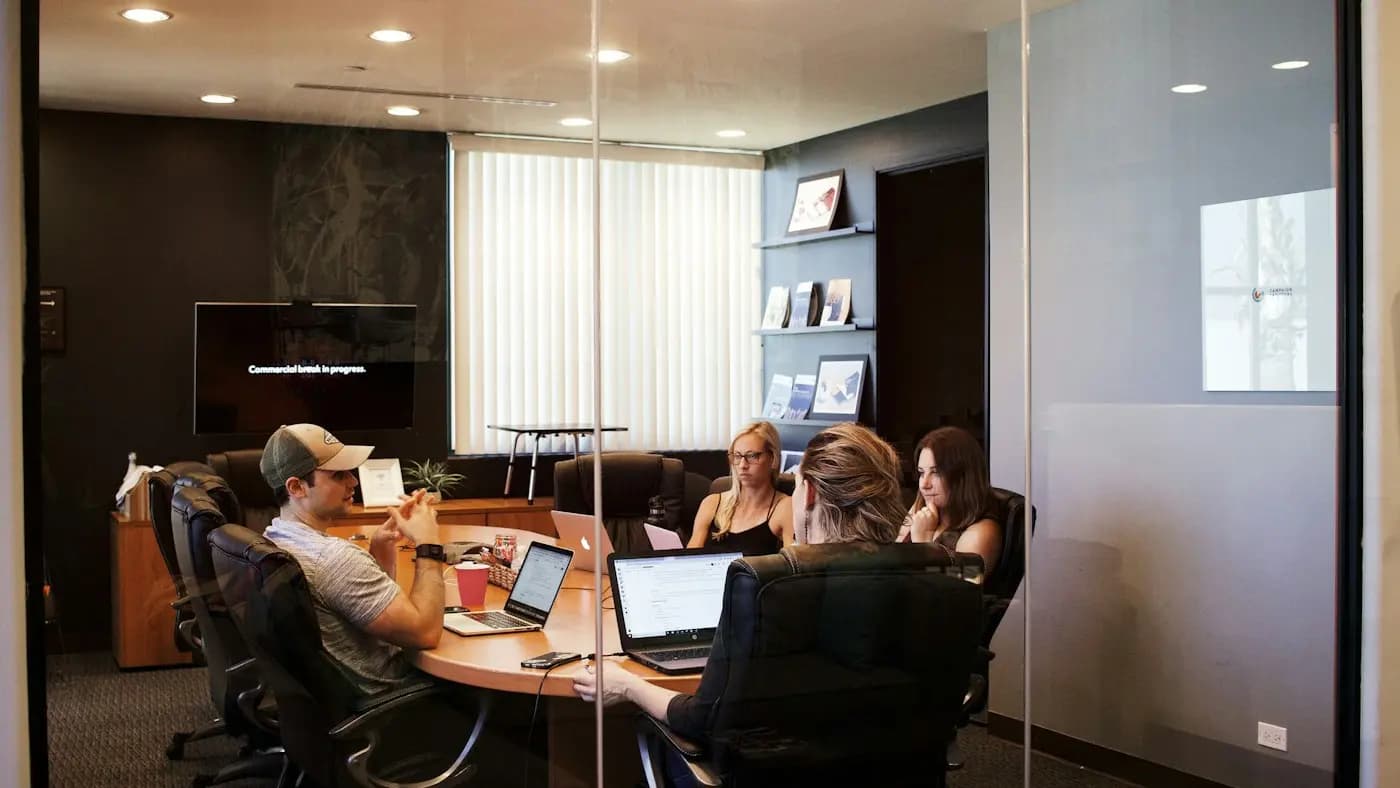 Team meeting in a glass-walled conference room