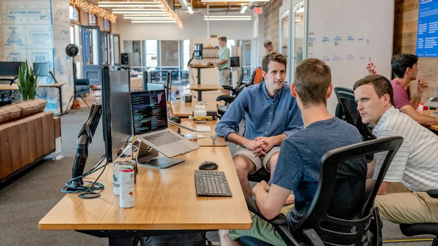 People working at desks in a loft office