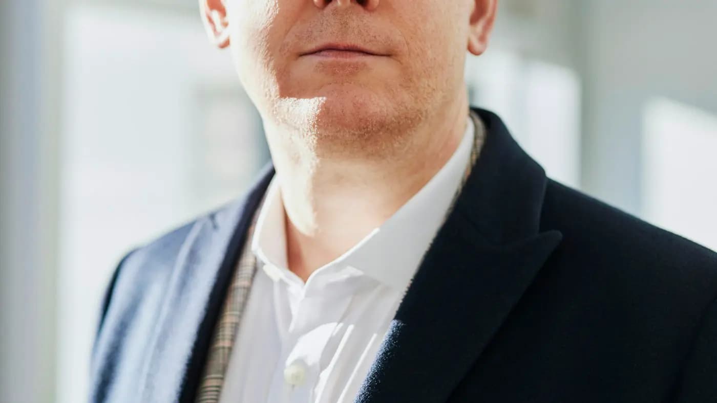 Portrait of a man in glasses and a jacket