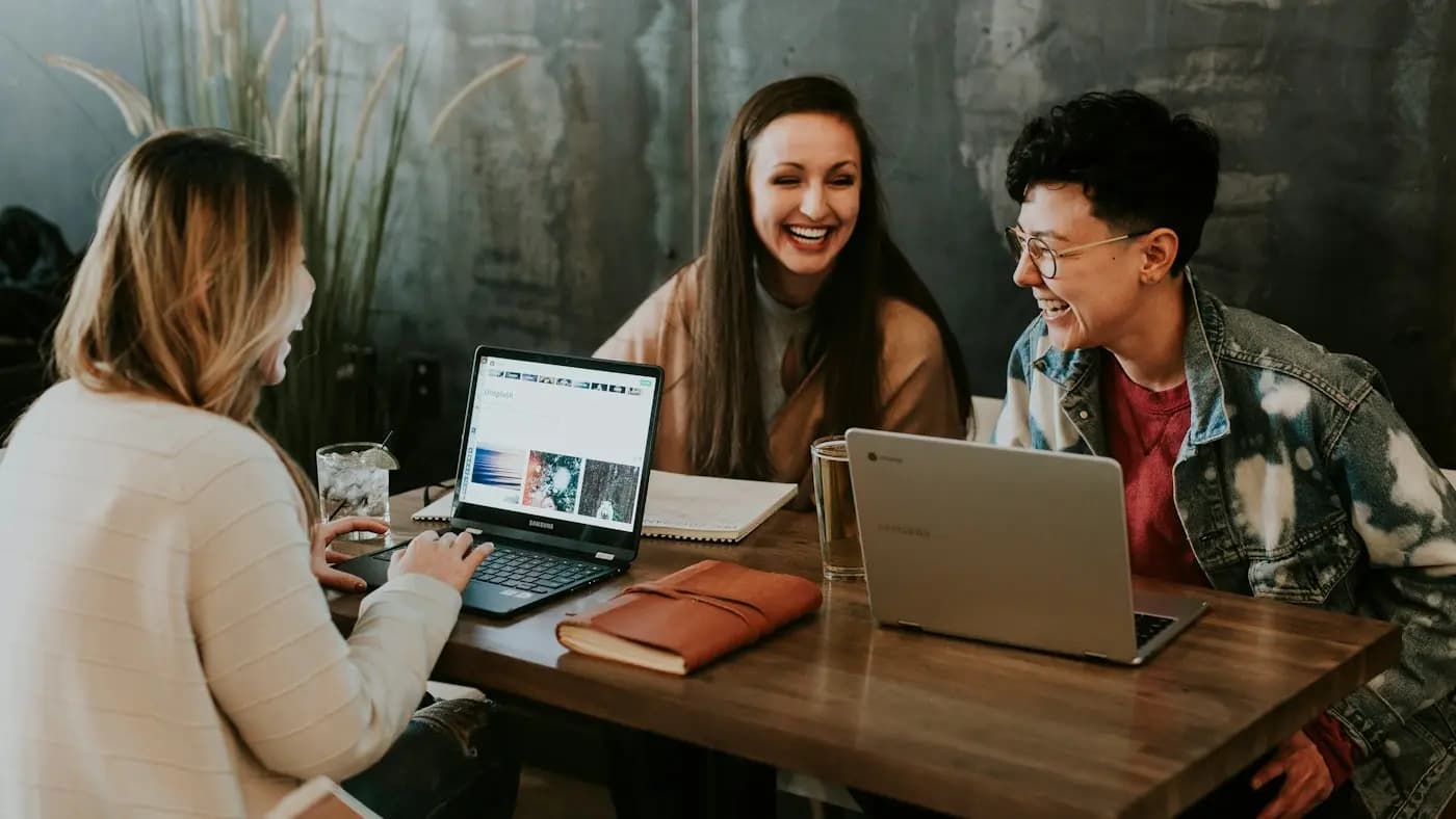 People looking at devices while collaborating
