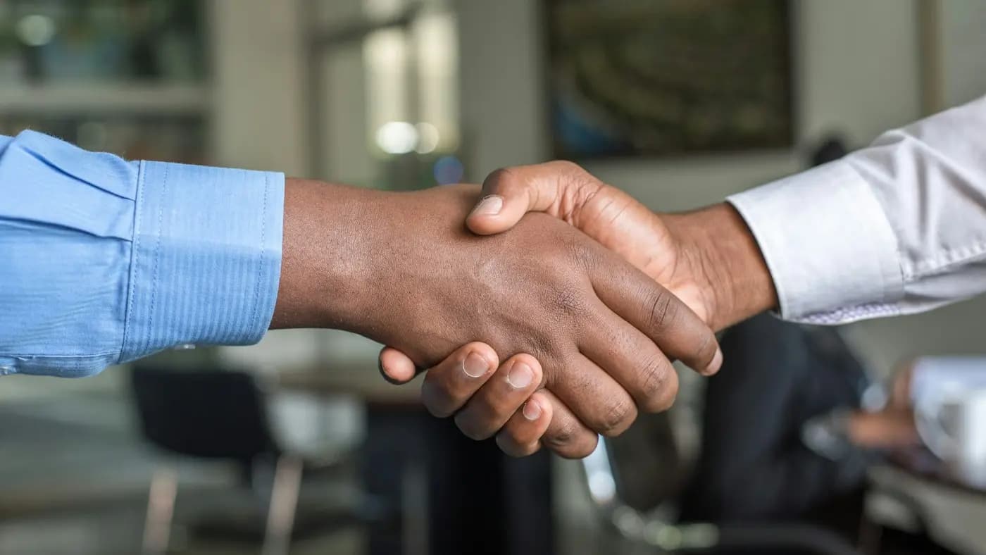 Two business people shaking hands