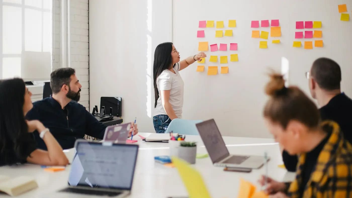 Team planning with sticky notes on a whiteboard