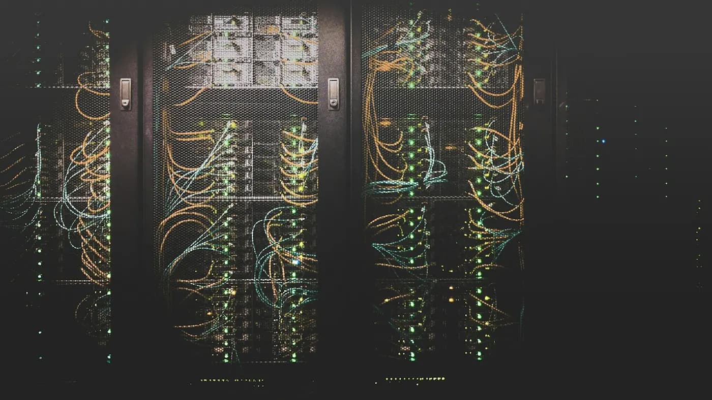 Rows of server racks with colourful cables in a data centre