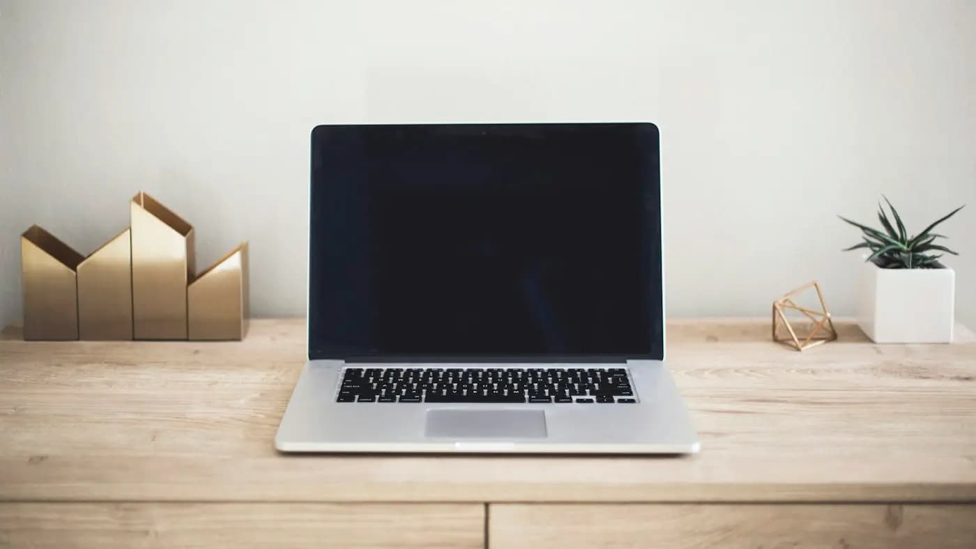 Laptop on a light wooden desk