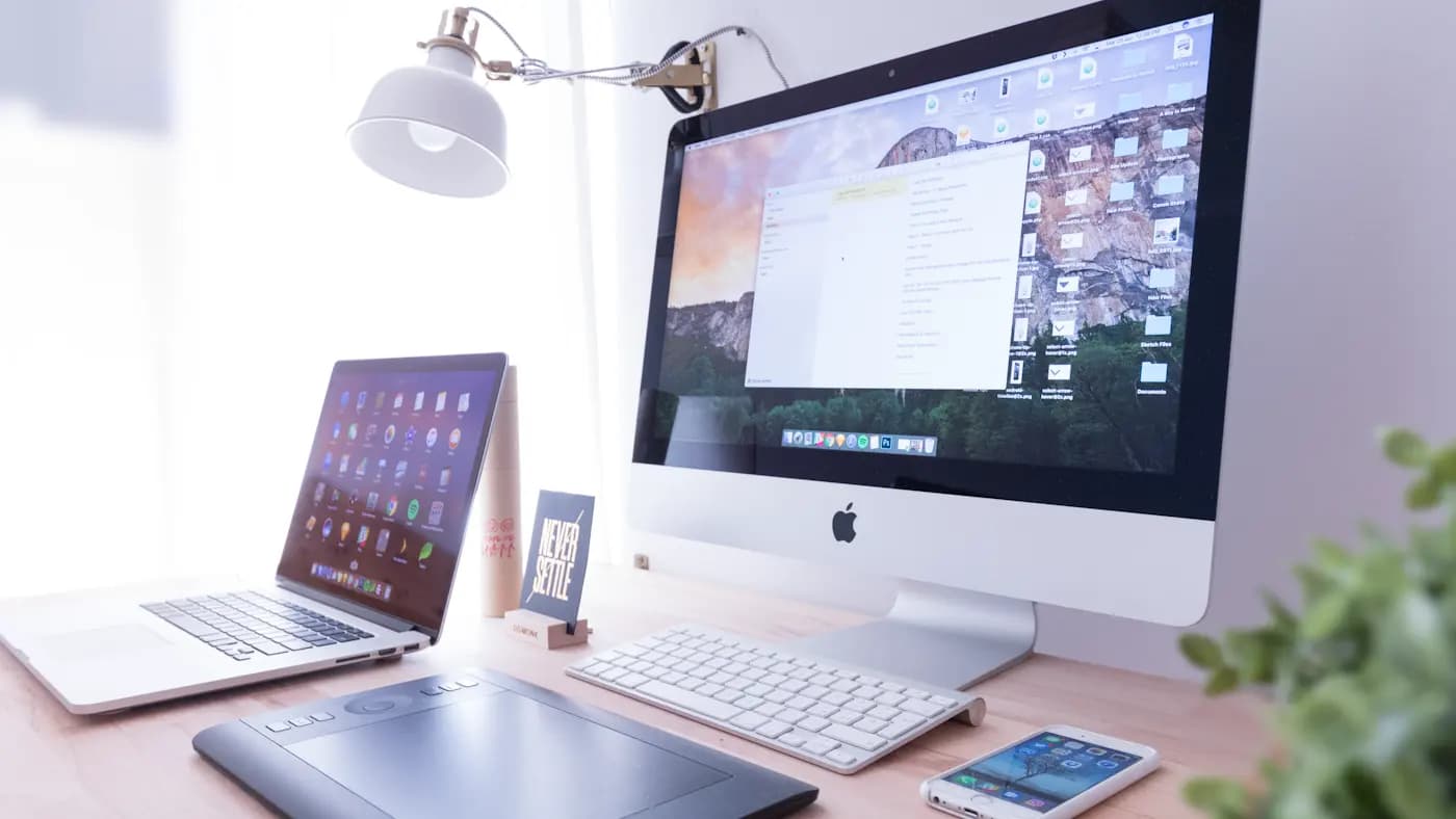 Desktop computer and devices on a tidy desk
