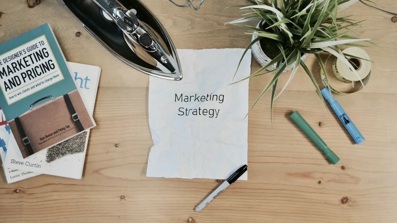 Marketing strategy note on a wooden desk